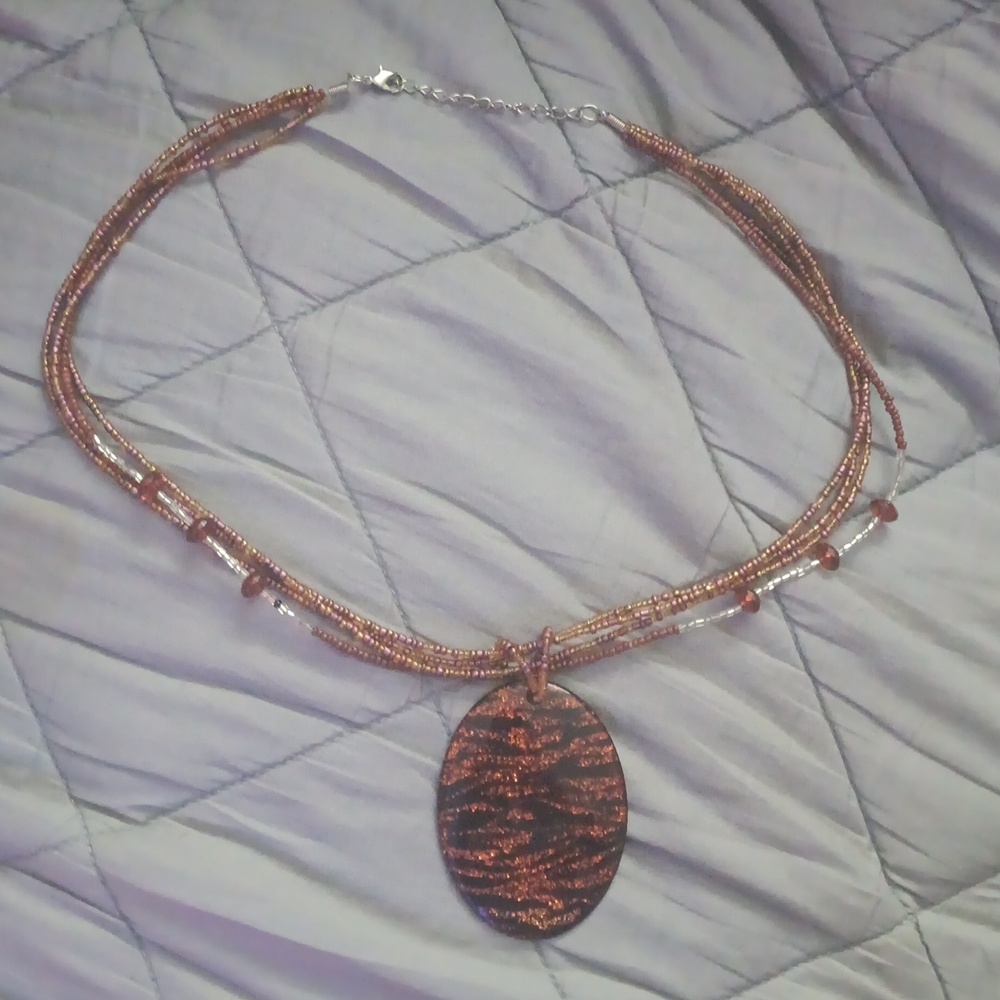 Quadruple Strand Necklace with Oval Pendant Brown